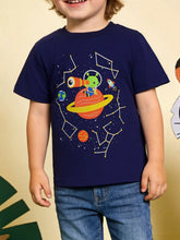 Front view of a dark navy children's tee with a green alien on a ringed planet, worn on a model