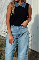 Black sleeveless sweater vest with contrasting denim collar, front view worn outdoors
