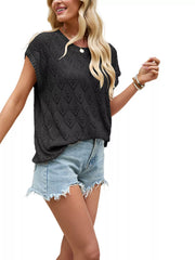 On-model front view of black openwork short sleeve knit top with heart shaped perforations against plain background