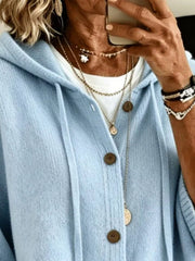 Close view of the sky blue hooded cardigan showing drawstrings and button front