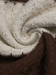 Close up of the soft cream and brown textured knit fabric on the striped top