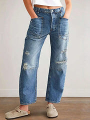 Women's distressed jeans with buttons and pockets in a non-stretch cotton blend.