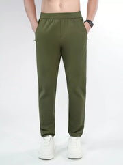 Men's army green slim-fit pants with a drawstring waist and pockets.