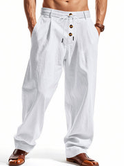 Men's white loose-fit pants with a drawstring waist and pockets.