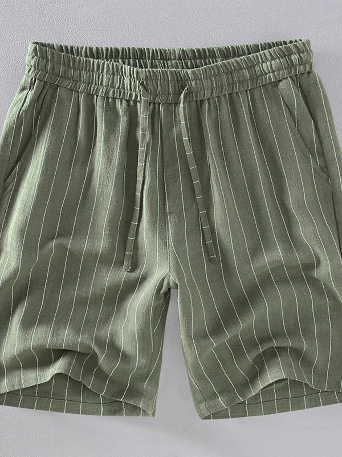 Men's army green striped shorts with a drawstring waist, available in plus sizes.
