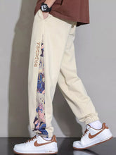 Men's tan sweatpants with bear print, side panels, a drawstring waist and pockets.
