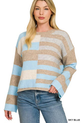 Front view of a sky blue, taupe and cream color block knit sweater with long sleeves
