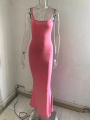 Front view of a burnt coral spaghetti strap bodycon maxi dress displayed on a clear mannequin