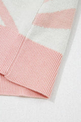Close-up of the pink ribbed hem on the cream cactus sweater vest