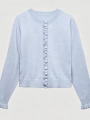Flat lay of light blue ruffle trimmed button down cardigan with ruffled placket and cuffs