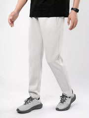 Men's plus-size stretch pants in light gray with an elastic waist and zipper pockets.