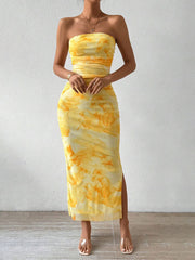 Front view of yellow ruched strapless bodycon midi dress with abstract print