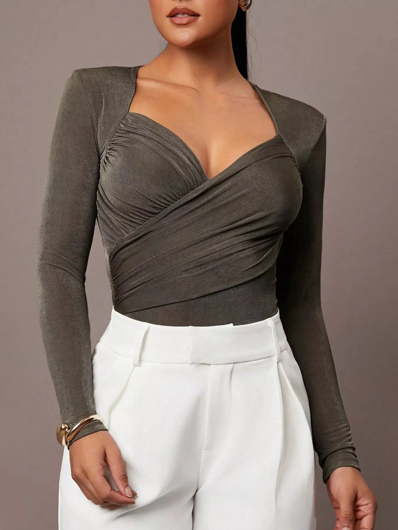 Army green ruched surplice long sleeve bodysuit styled with white trousers, front view