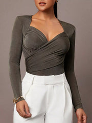 Army green ruched surplice long sleeve bodysuit styled with white trousers, front view