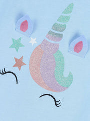 Close-up detail of the glitter unicorn horn, ears and stars on the sky blue tee