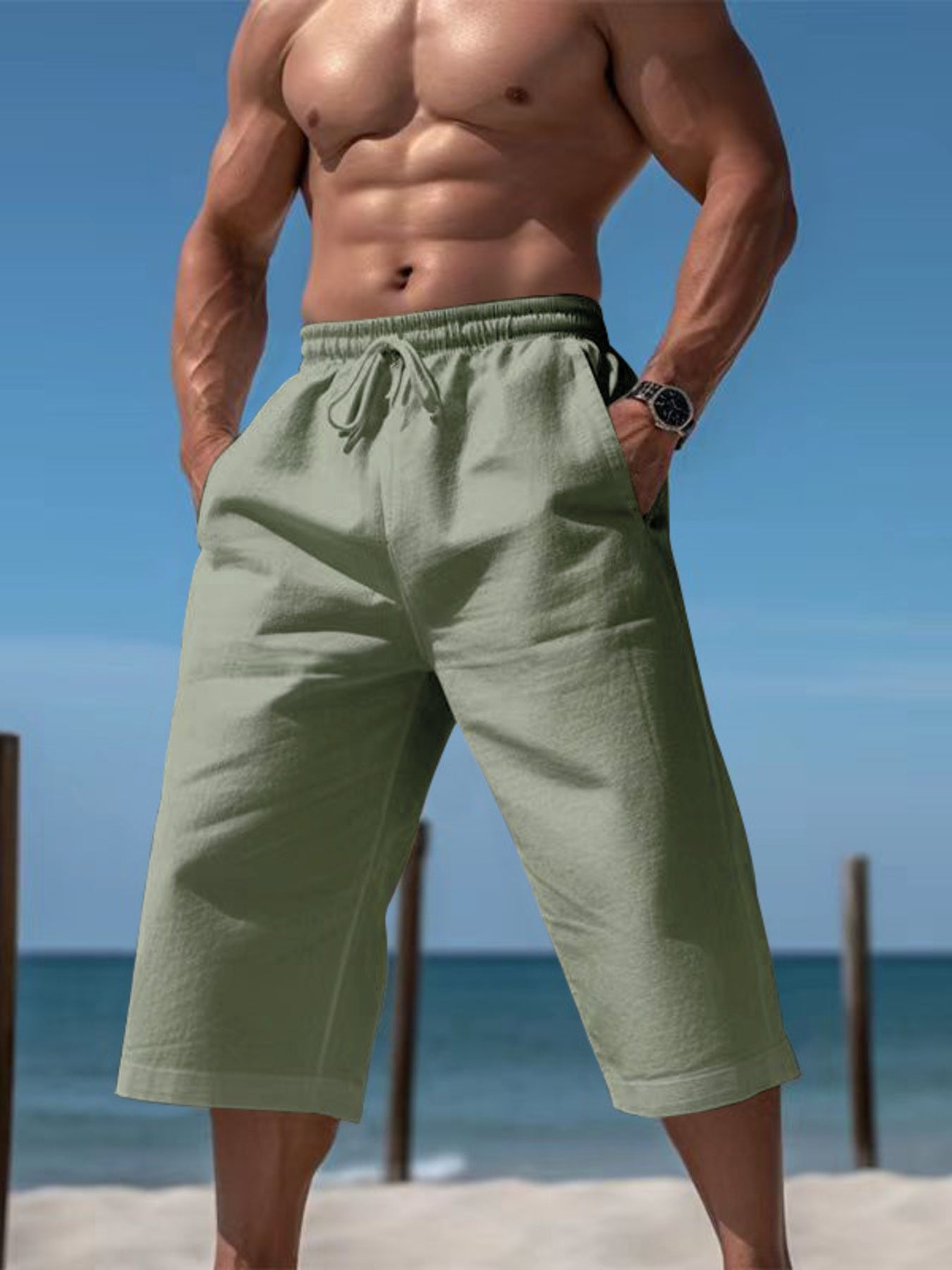 Men's light green cropped casual pants with a drawstring waist and pockets.