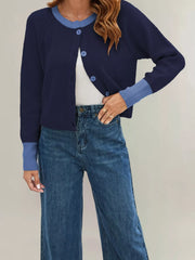 On-model front view of a navy ribbed cardigan with light blue trim and blue buttons