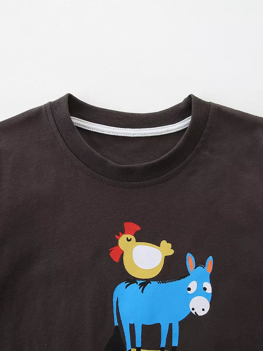 Close up of chocolate children's t-shirt round neckline with white inner trim and chicken donkey print