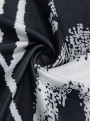 Close view of black and white abstract print fabric on a sleeveless bodycon maxi dress