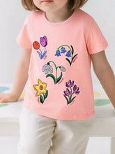 Front view of a pink children's tee with cartoon tulip, bluebell, snowdrop, daffodil and crocus flowers, worn on a model