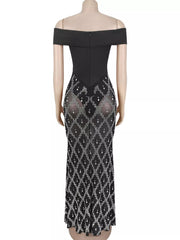 Back view of black off shoulder maxi dress with back zip and rhinestone skirt on mannequin