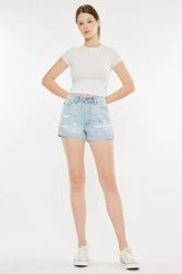 Women's high-rise mom denim shorts with repaired detailing, a washed finish, and pockets.