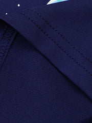 Close view of the navy children's tee fabric and double stitched seam in a folded detail