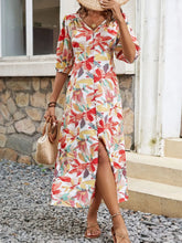 Women's multicolored printed midi dress with a V-neck and half sleeves.