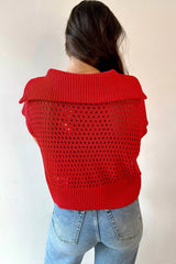 On-model back view of the red openwork knit top showing its ribbed collar and hem