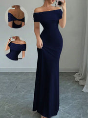 Model in full length mirror selfie wearing dark blue off shoulder bodycon maxi dress with back detail insets