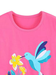 Close-up of the hot pink children's t-shirt neckline above a hummingbird graphic