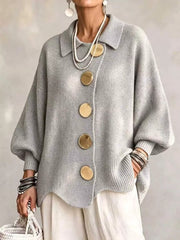 Front view of a light gray knit cardigan with large gold buttons