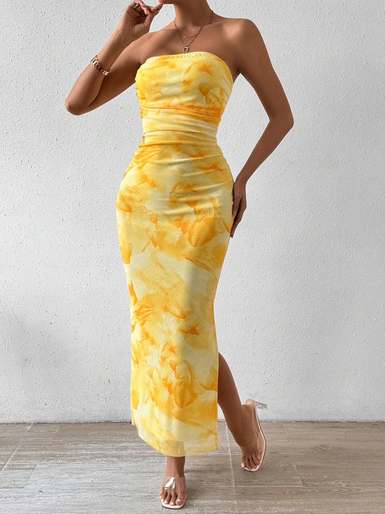 Yellow ruched strapless bodycon midi dress with abstract print, three quarter front view