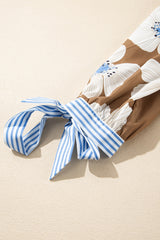 Blusa con mangas anudadas y estampado floral a rayas