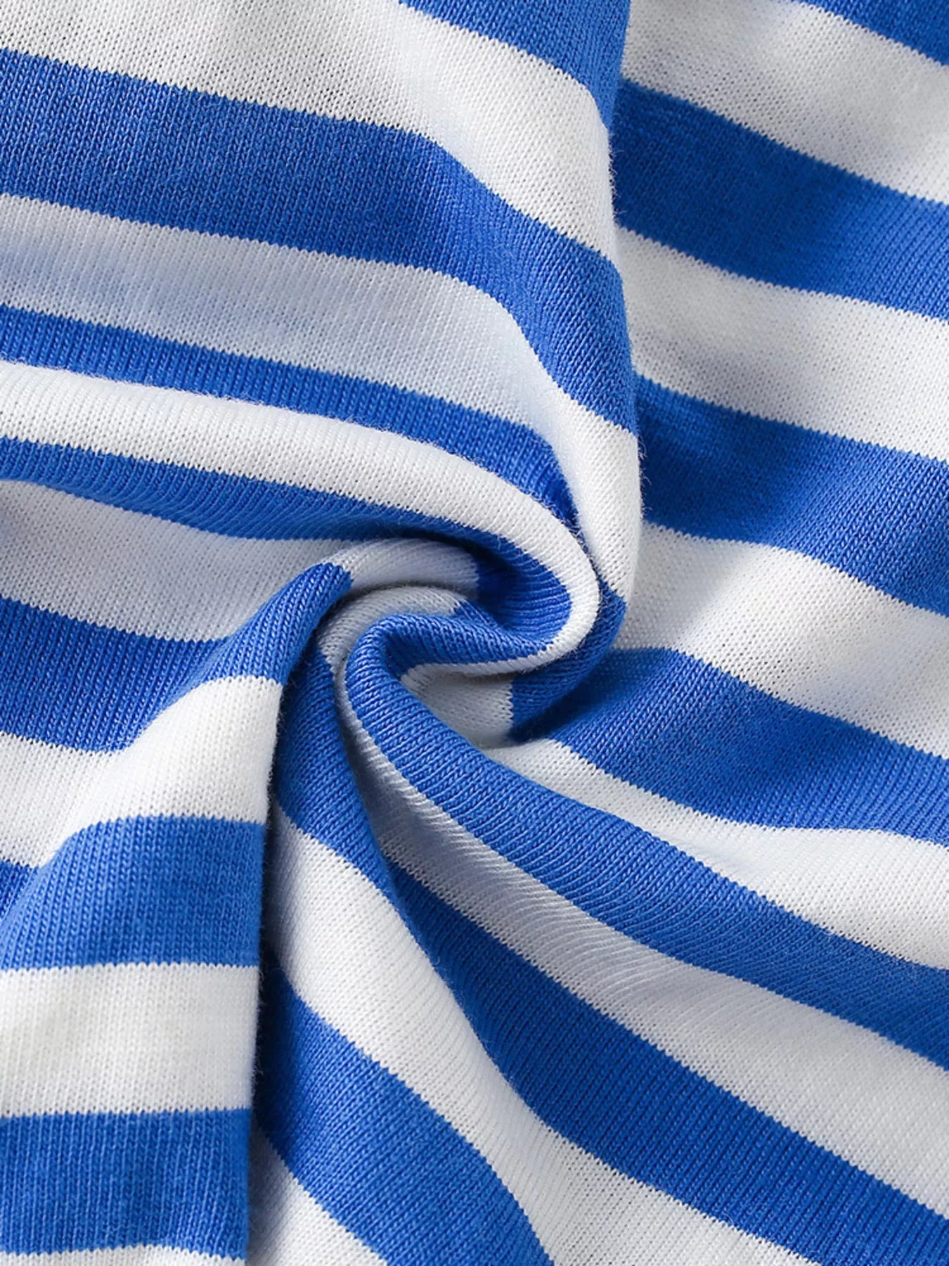 Close up of the blue and white striped cotton fabric on a children's short sleeve tee