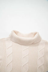 Close-up of the cream cable knit turtleneck sweater front neckline