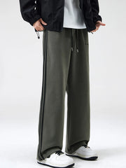 Men's army green relaxed-fit pants with side stripes, a drawstring waist and pockets.