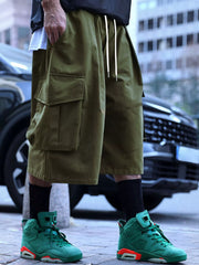 Men's army green cargo shorts with a drawstring waist and pockets.