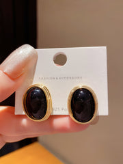 Black and Gold Toned Oval Clip On Earrings