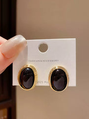 Black and Gold Toned Oval Clip On Earrings