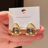 Chic Gold Tone Drop Earrings with Geometric Blue Smooth Accent