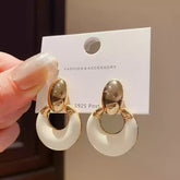 Exquisite Geometric Earrings with Smooth Toned Finish