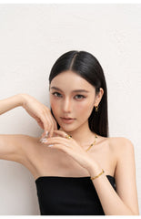 Gold Chunky Curb Chain Bracelet with Black Heart Detail
