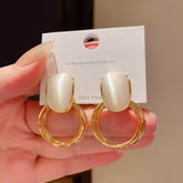 Gold Tone Drop Earrings with Iridescent White Stone on Double Hoops