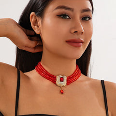 Multi-Layer Red Bead Choker with Rhinestone Pendant