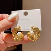 Refined Gold Tone Abstract Swirl Stud Earrings with Creamy White Faux Pearl