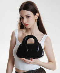 Small Black Top Handle Bag with Unique Gold Tone Hand Sculpture