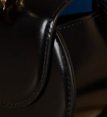 Sophia Black Leather Top Handle Bag with Unique Clock Face Clasp