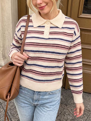 Front view of a striped polo collar sweater with a cream collar and button placket