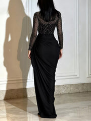 Black mock neck maxi dress with sheer rhinestone bodice and ruched skirt, back view
